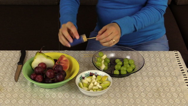 hand make snack grape and pears on wooden stick fruit vase table