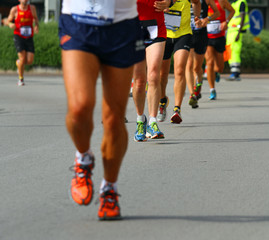 legs of athletes engaged in long international marathon