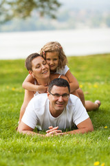 Happy family posing outdoors