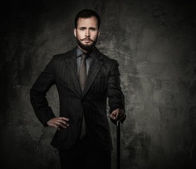 Handsome well-dressed man with walking stick