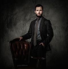 Handsome well-dressed  standing leather chair