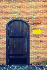 Old door with brick wall