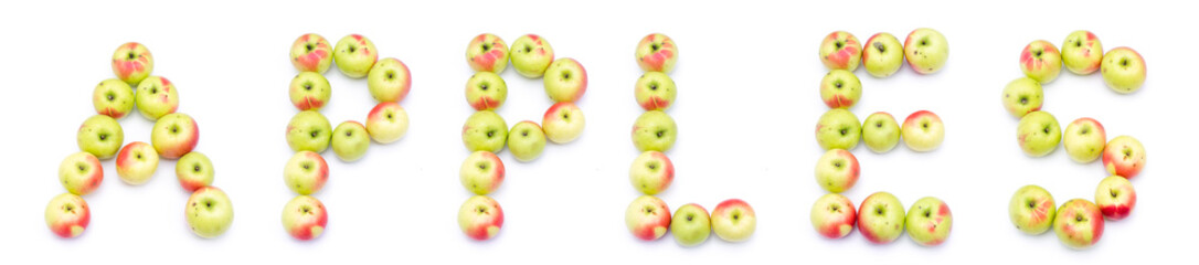 the word apples spelled out of yelloe green red fresh apples on