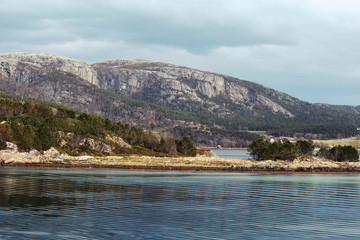 Norwegian coastal landscape with sea, sky and mountains