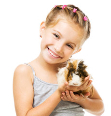 Little girl holding a guinea pig