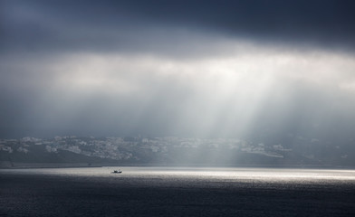 Sunlight goes through stormy clouds. Tangier, Morocco
