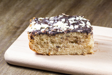 Chocolate cake portion on wood table