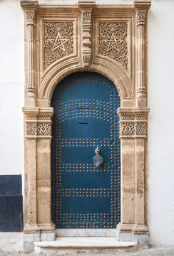 Ancient blue door with decoration. Tangier, Morocco