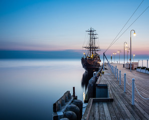 Sunrise at the pier in Sopot, Poland. 