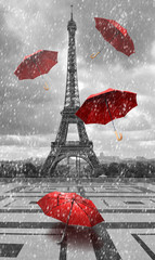 Eiffel tower with flying umbrellas.
