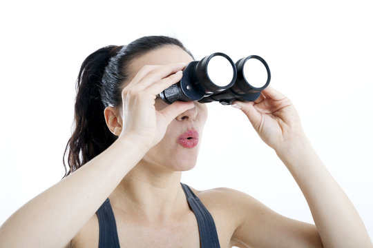 beautiful woman searching with binoculars