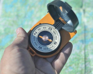 Compass in hand.