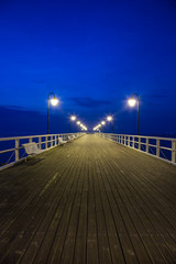 Sunrise on the pier at the seaside, Gdynia Orlowo, Poland