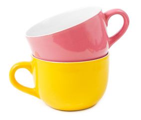Stacked yellow and purple mugs