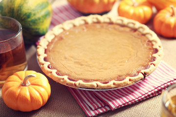 Pumpkin pie with small pumpkins