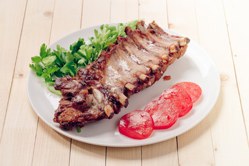 Plate with roasted pork ribs