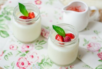 Homemade Yogurt  in jar with strawberries. Selective focus