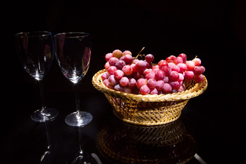 Glasses with wine and grapes
