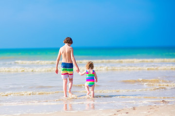 Kids walking on a beach