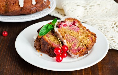 Fototapeta na wymiar Marble berry cake with red currant on wooden backgraund. Slice of cake. Selective focus