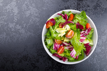 Fresh mixed salad with endive and cherry
