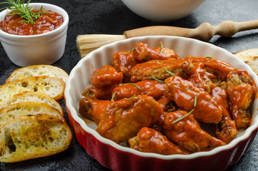 Hot chicken wings, habanero souce, salad