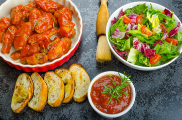 Hot chicken wings, habanero souce, salad