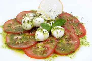 appetizer with tomatoes and cheese in a restaurant