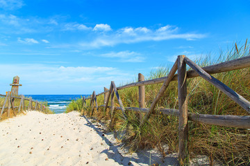 Entrance to the beach with white sand