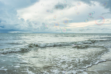 Bubbles in the air with seascape background.
