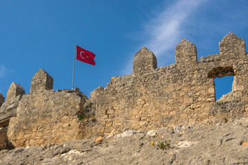 Ancient ruins of Byzantine fortress with Turkish flag in Burch b