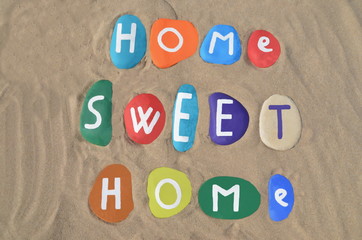 Home sweet home concept on colored stones