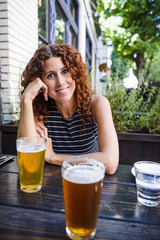 smiling woman having beer