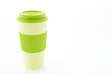 Green plastic coffee mug isolated on white background