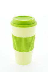 Green plastic coffee mug isolated on white background