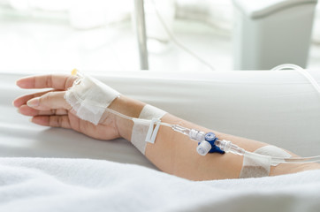 close up patients hand with saline solution