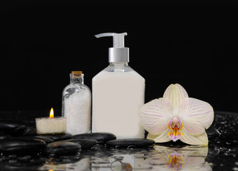 Fototapeta na wymiar Still life with orchid, massage oil, candle