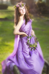 Fototapeta na wymiar Beautiful girl with flower wreath