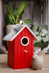 Red wooden bird house