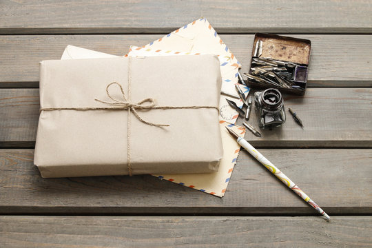 Parcel wrapped with brown paper on table