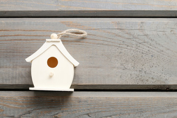 Tiny house on wooden background