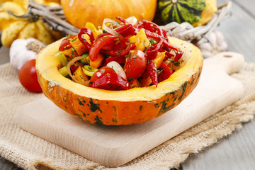 Vegetable salad served in pumpkin