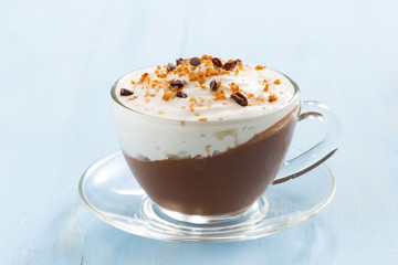 chocolate dessert with cream and amaretti on a blue background