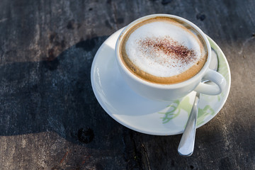 Coffee cup on wooden table