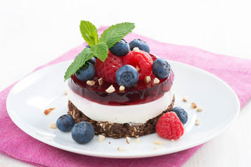 delicious cake with fruit jelly and fresh berries