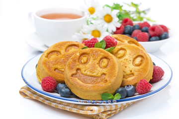 delicious corn pancake with berries, tea and honey for breakfast
