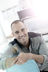 Portrait of student in front of desktop computer