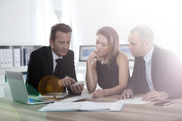 Business people looking at budget forecast