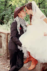 Bride kissing groom, tinted