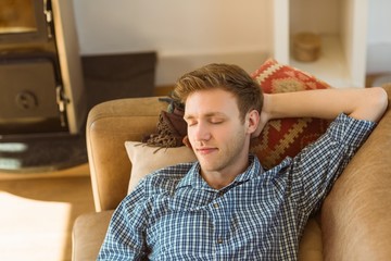 Young man napping on his couch